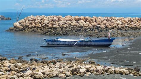 A Traditional Blue Boat In A Sulawesi Fishing Village Stock Photo