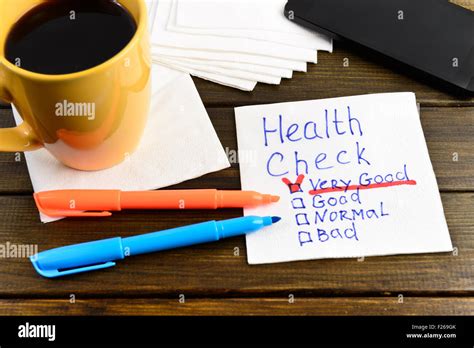 Health Test Handwriting On A Napkin With A Cup Of Coffee And Phone