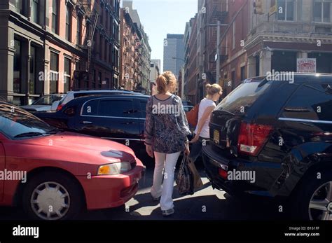 Pedestrians Thread Through Backed Up Traffic From The Holland Tunnel On