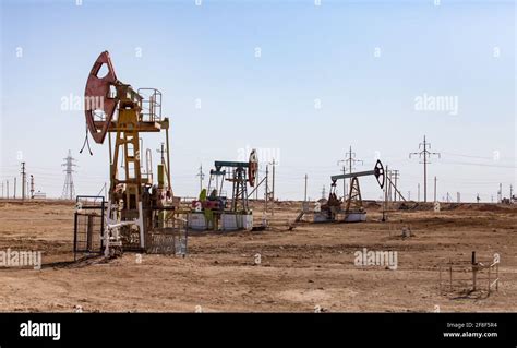 Oil Pumping Jacks In Desert Oil Field Zhanaozen Kazakhstan Stock