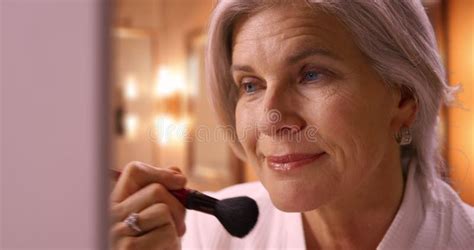 Lovely Mature Woman In Her 50s Posing With Arms Crossed On Quiet Street