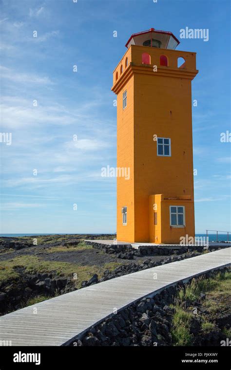 Iceland, Snaefellsness peninsula, yellow lighthouse at Hellissandur ...