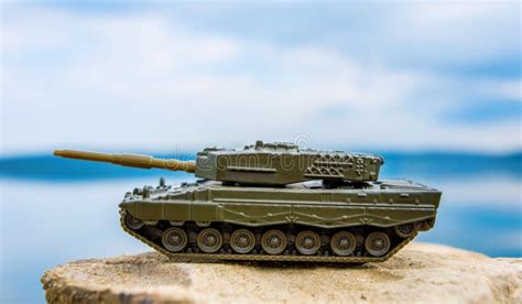 Toy Tank on Nature Background with Blue Sky and Lake Stock Photo ...