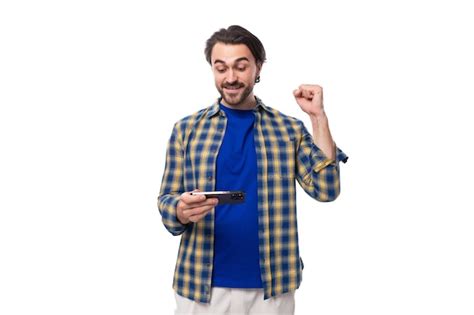 Premium Photo Wellgroomed Brunette Brutal Man With A Beard In A Plaid