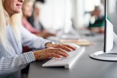 Group Of Unrecognizable Unemployed Businesspeople Sitting In Row On