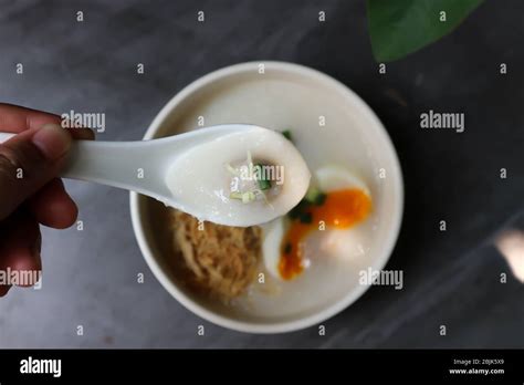 Eating Rice Gruel Rice Porridge Or Congee Stock Photo Alamy