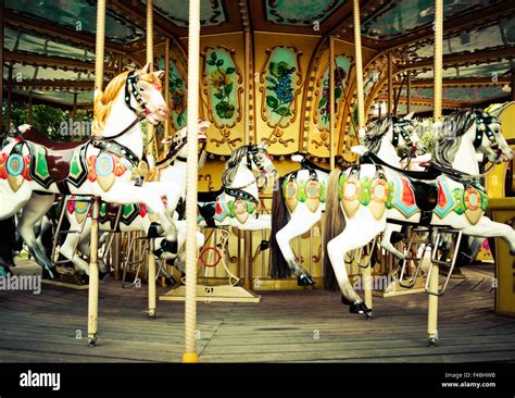 Horses On A Carnival Merry Go Round Stock Photo Alamy