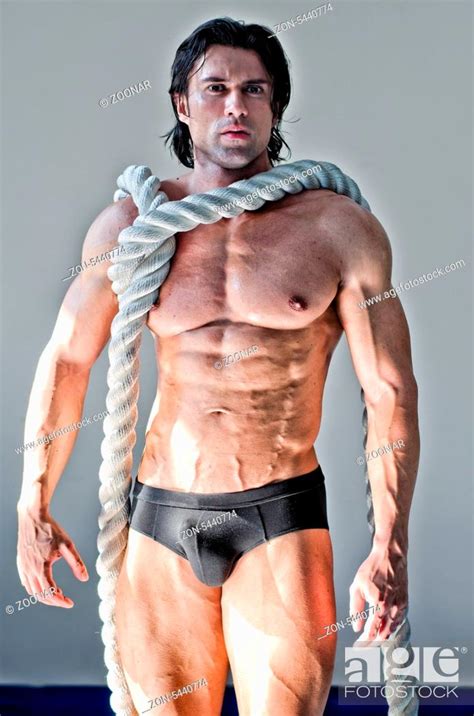 Muscular Man Nearly Naked With Heavy Big Rope Around Neck Looking At