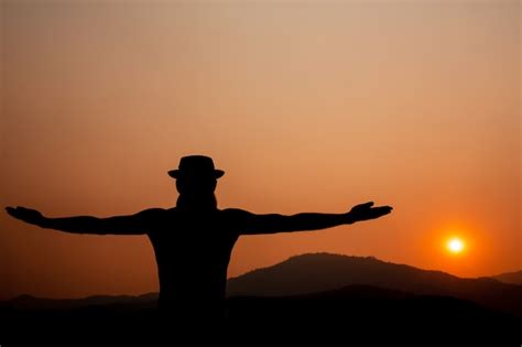 Free Photo | Silhouette of a man with outstretched arms.