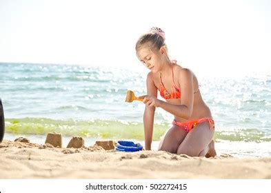 Girl Playing Sand On Beach Girl Stock Photo Edit Now 460361518