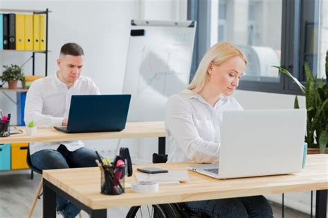 Free Photo | Woman in wheelchair working at her desk