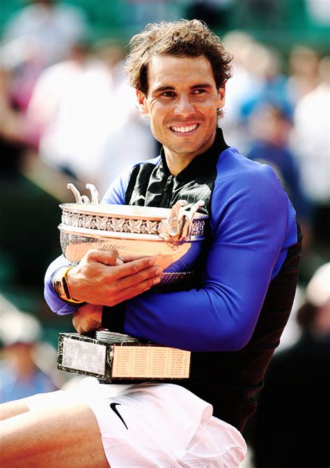 Rafael Nadal Celebrates Victory With The Trophy Following The Mens Singles Final Against Stan