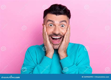 Portrait Photo Of Young Funny Guy Wear Trendy Blue Jumper Touch Cheeks Crazy Reaction Unexpected