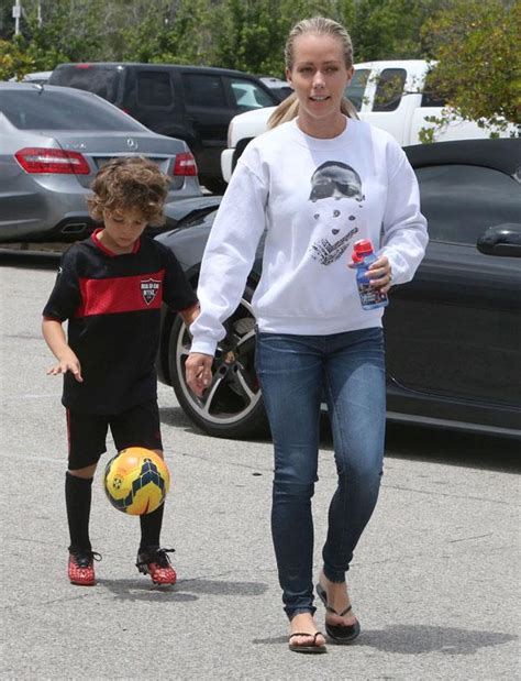 Kendra Wilkinson Looks Stressed As She And Hank Baskett Watch Their Son