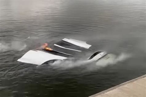 Horrifying Moment Tesla Malfunctions And Plunges Into Lake Before Bursting Into Flames