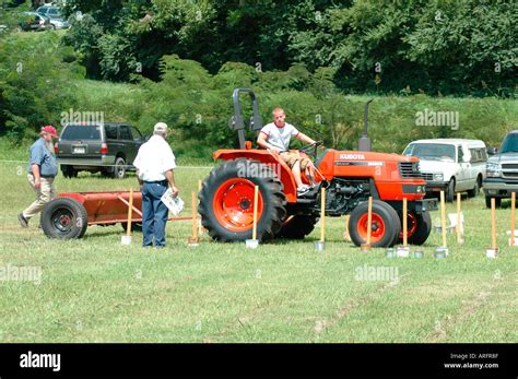 High School Students Learning How To Drive A New Real Tractor With