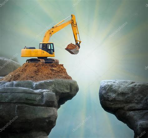 Excavator digging big hole. Stock Photo by ©vladvitek 95874932