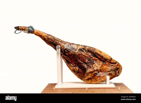 Spanish Iberico Ham On Ham Holder On Wooden Table Stock Photo Alamy