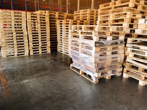 Wooden Pallets Stack At The Freight Cargo Warehouse For Transportation