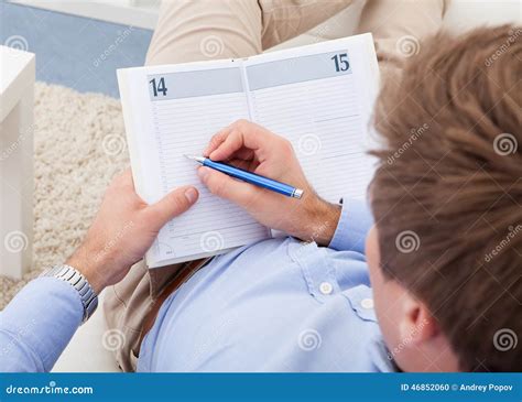 Young Man Writing In Diary Stock Photo Image Of Inside 46852060