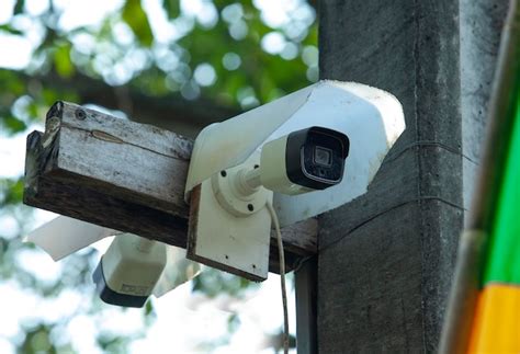 Premium Photo Two White Cctv Cameras Mounted On A Pole