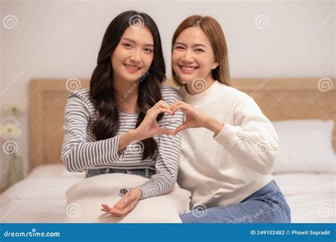 Close Upasian Lesbian Couple Making Heart Shape Sign Hug And Smiling With Love Together Stock