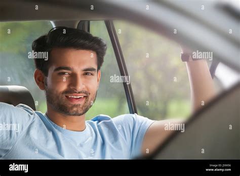 Portrait Of Young Man Sitting In Car Stock Photo Alamy