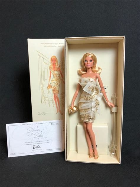 Lot - BOXED PLATINUM LABEL BARBIE - "GLIMMER OF GOLD". THIS DOLL WAS ...