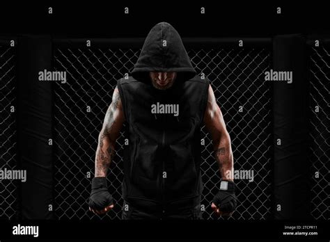 Conceptual Image Of A Kickboxer A Real Fighter Stands In The Real Cage