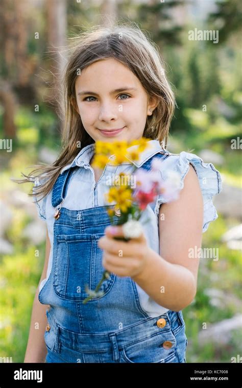 Portrait Of Girl 8 9 Holding Wildflowers Stock Photo Alamy