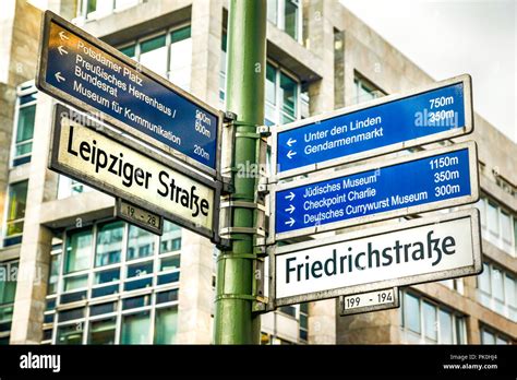 Multiple Destinations Signpost On The Corner Of Friedrichstrasse And