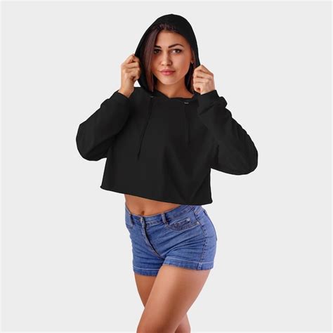 Premium Photo Black Crop Top Hoodie On A Pretty Girl In Blue Shorts Wearing A Hood In The