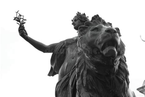 Low Angle Shot Of A Beautiful Statue Of A Roman Goddess On A Lion