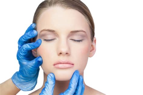 Premium Photo Surgeon Examining Gorgeous Blonde Model