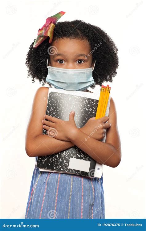 Young African American Girl Wearing A Surgical Mask And Ready To Go