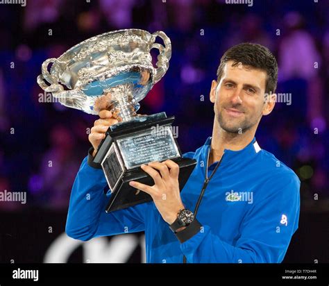 Serbian Tennis Player Novak Djokovic Posing With Trophy Melbourne Park