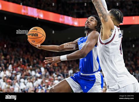 Auburn Forward Johni Broome Defends Against A Shot By Kentucky