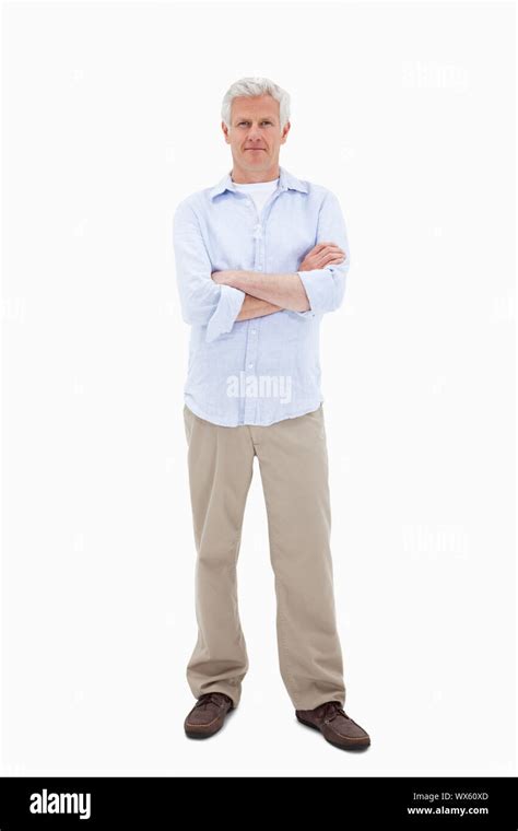 Mature Man Standing Up Against A White Background Stock Photo Alamy