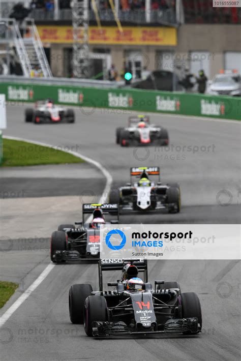 Fernando Alonso ESP McLaren MP4 31 Leads Jenson Button GBR McLaren