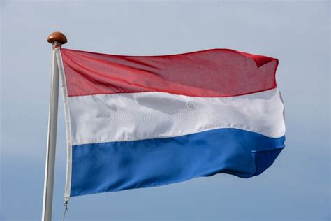 Dutch Flag Waving Against Blue Sky Stock Photo Image Of Dutch