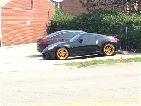 Gold Rims On A Black Car Scrolller