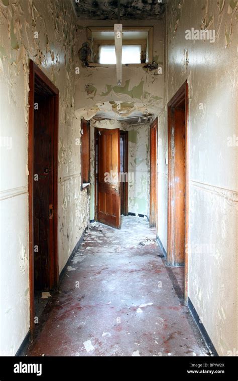 Corridor In An Abandoned Mental Asylum Psychiatric Hospital In Mid