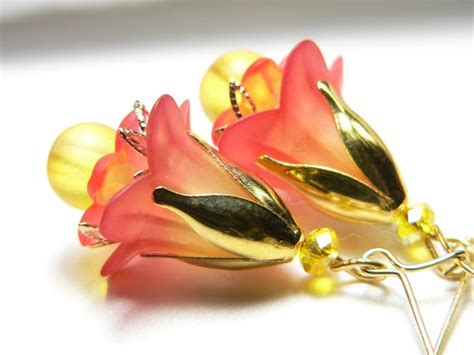 Hand Dyed Papaya And Yellow Lucite Flower Earrings With Gold Tone Bead