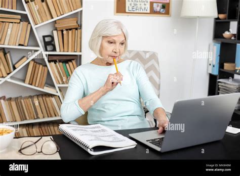Concentrated Mature Woman Trying Freelance Stock Photo Alamy