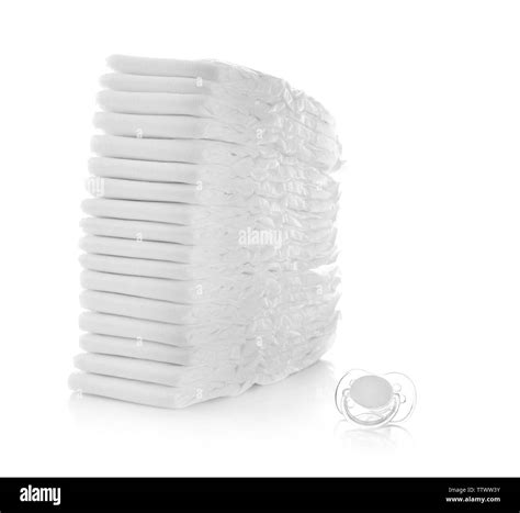 Stack Of Baby S Diapers And Dummy Isolated On White Stock Photo Alamy