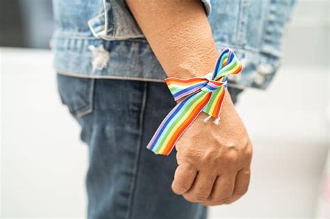 Premium Photo Asian Lady Wearing Rainbow Flag Wristbands Symbol Of