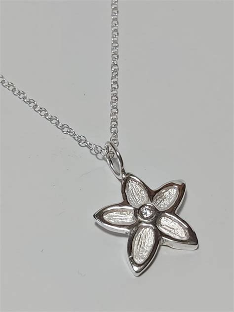 Sterling Silver Flower Pendant With Cubic Zirconia