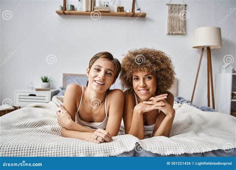 Happy Lesbian Partners Looking At Camera Stock Photo Image Of Female Lying