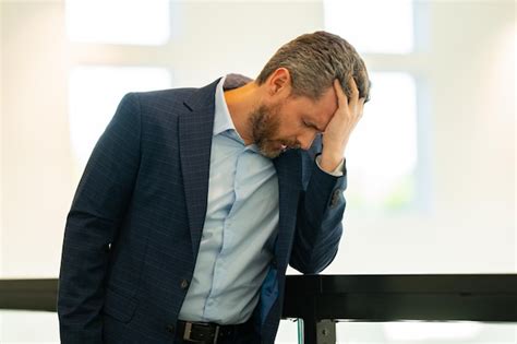 Premium Photo Stressed Business Man Having Headache At Home Office Tired Businessman Is