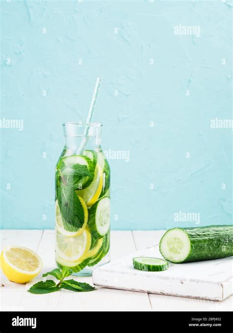 Infused Detox Water With Cucumber Lemon And Mint In Glass Bottle On